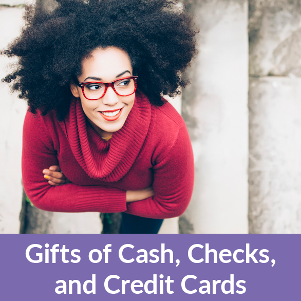 A woman smiling. Gifts of Cash, Check, and Credit Cards Rollover