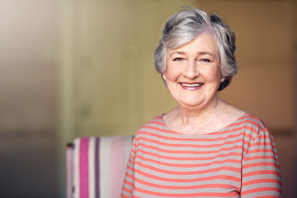 Photo of a woman smiling. Link to Life Stage Gift Planner Ages 45-65 Gifts.
